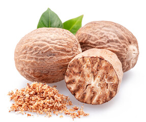 Nutmeg and ground nutmeg heap isolated on white background.