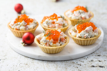 Traditional Russian salad with red caviar