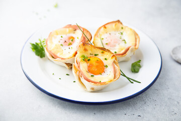 Baked eggs with bacon and chives
