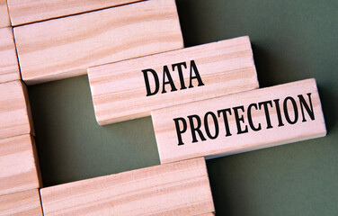 DATA PROTECTION - words on wooden blocks on dark green background