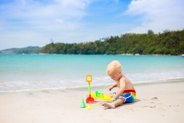 Kids playing on beach. Children play at sea.