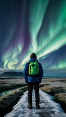 Tuinposter Photo real for Traveler gazing at the Northern Lights in Iceland in Backpack traveling theme ,Full depth of field, clean bright tone, high quality ,include copy space, No noise, creative idea © Gohgah