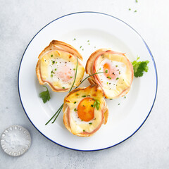 Baked eggs with bacon and chives
