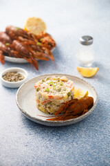 Traditional Russian salad with crawfish