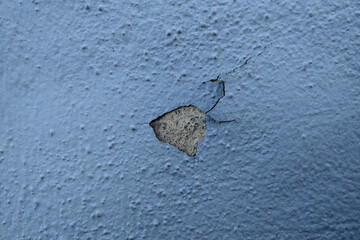 Crack in the Side of a Blue Wall - 766942593