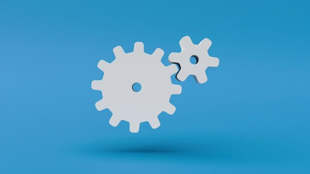 Two white cogs turning on a blue background