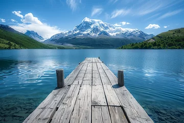  A rustic wooden dock extending over a crystal-clear mountain lake, surrounded by towering snow-capped peaks © Izhar