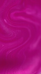 Shimmering paint. Ink flow. Liquid blend. Defocused neon glowing pink purple color shiny acrylic pigment mix stream motion art abstract background.