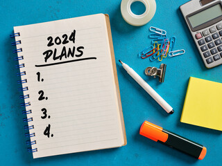 2024 plans list handwritten on a notebook.