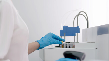 Blood samples in a modern automatic device for analyzing blood biochemical parameters. Professional biotechnological laboratory research.