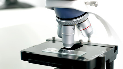 Using a high-tech microscope, scientists examine the sample in a modern industrial laboratory....