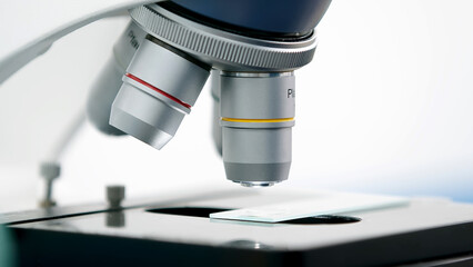 Using a high-tech microscope, scientists examine the sample in a modern industrial laboratory. Science and technology. Tests. Medical experiment.