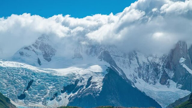 Timelapse view of Cerro Torre Mountain in snow with glacier and thick clouds in Torre Lagoon, El Chalten, Argentina.