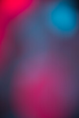 Defocused Abstract background with defocused color light bokeh and bright. Color neon pink blue...