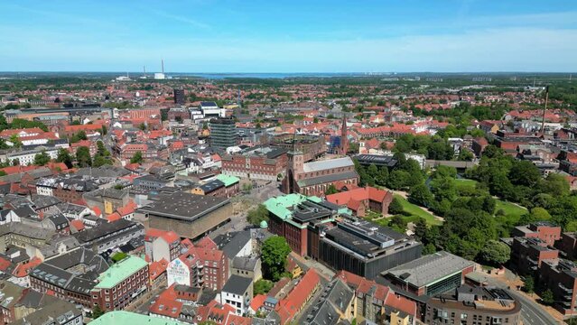 Odense, Denmark: Aerial view of city on island of Funen, summer sunny day with clear blue sky - landscape panorama of Europe from above

