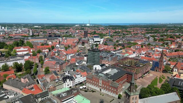 Odense, Denmark: Aerial view of city on island of Funen, summer sunny day with clear blue sky - landscape panorama of Europe from above
