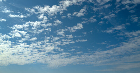 Blue Heaven and white clouds. Sky clouds background. White cloudy on Heaven with soft sun light. Clouds on pastel blue sky background. Sky Landscape Background. Sky Clouds Wallpaper.