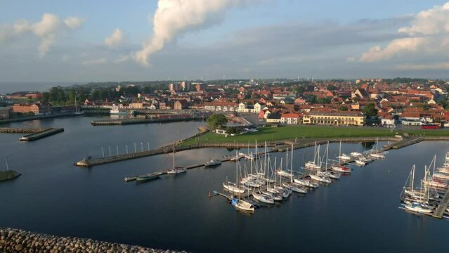 Simrishamn, coastal town and marina. Establishing drone shot. Tourist destination in Sweden.