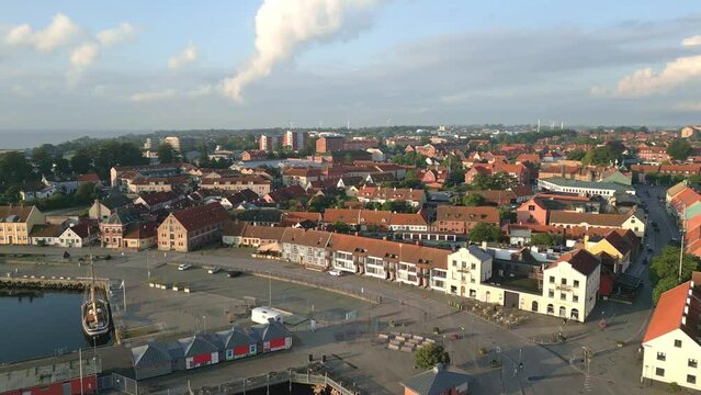 Simrishamn, coastal port town in Sweden. Fly-over drone shot.