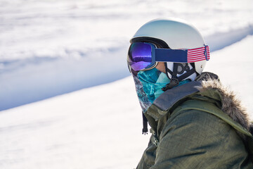 Fototapeta na wymiar Snowboarder Reflecting on the Slopes