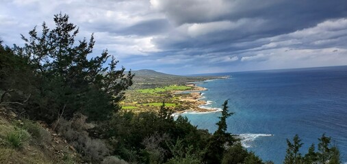 Obraz na płótnie Canvas Beautiful blue Mediterranean sea from mountain trail, storm approaching.