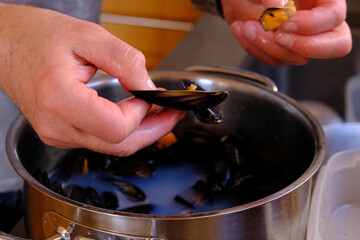 Cooking mussels to make paella.