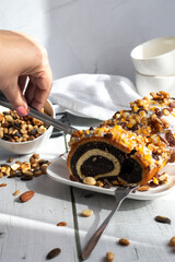 Roll with poppy seeds on a wooden background. dessert