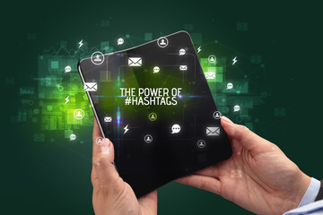 Businessman holding a foldable smartphone, social media concept