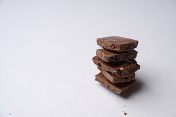chocolate pieces on a white background
