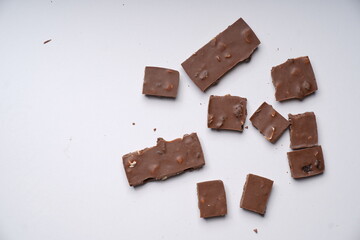 chocolate pieces on white background