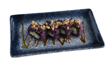 Tampico purple rice sushi with Philadelphia cheese, avocado and fresh salmon on a transparent background. cutout. High quality kitchen.