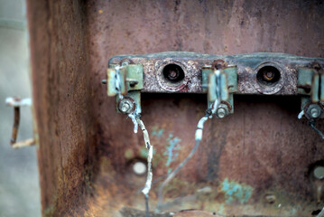 Oxidized wires in rusty electrical panel
