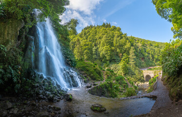 Discover the enchanting Ribeira dos Caldeiroes Park in Sao Miguel, a serene Azorean haven featuring lush landscapes and cascading waterfalls. - 767003314