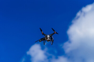Drone flying in the blue sky