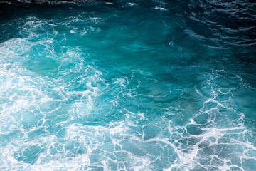 Blue ocean texture with waves and foam