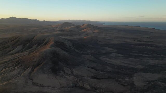Ancient volcanic landscape along Fuerteventura's north coast, near El Cotillo and Majanicho, by Faro del Toston