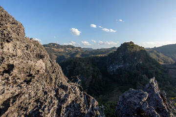 mountain landscape on a high cliff, strange mountain rocks in Thailand See fertile mountains and many clouds in the sky. The cool wind blows and refreshes the heart.