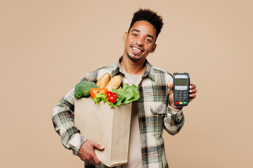 Young man he wear grey shirt hold paper bag mock up with food products, bank payment terminal...