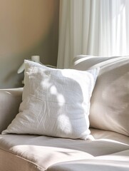 Fototapeta na wymiar There is a white square pillow on the soft sofa 