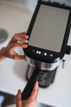 Close-up of hands operating modern digital device