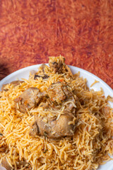 Indian famous mutton biryani is a delicious and fragrant dish served on a white plate.