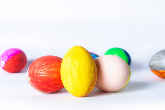 Colorful easter eggs on white background with copy space for text.