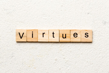 virtues word written on wood block. virtues text on cement table for your desing, concept