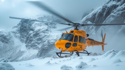  A yellow helicopter rests atop a snowy peak, surrounded by mountains blanketed in snow