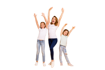 Full length body size portrait of three nice lovely slim attractive cheerful cheery positive ecstatic people having fun raising hands up isolated over bright vivid shine yellow background