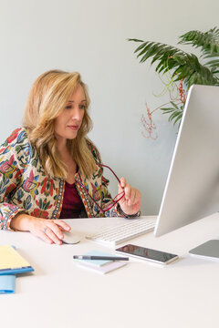 Professional blonde businesswoman working at her desk