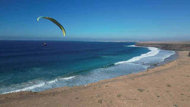 Paragliding over the serene coastline of Fuerteventura