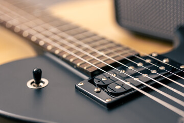 Photo of details of an electric guitar close up.