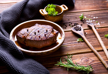 Baked steak on wood