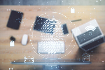 Double exposure of abstract creative fingerprint hologram on laptop background, research and...